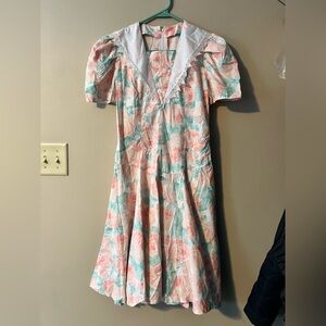 Vintage hand made 1980s dress. Full zip back, v neck with insert dropped waist.